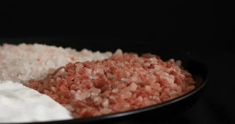 Different salt types rotating on black background 6 Stock Footage 140928061