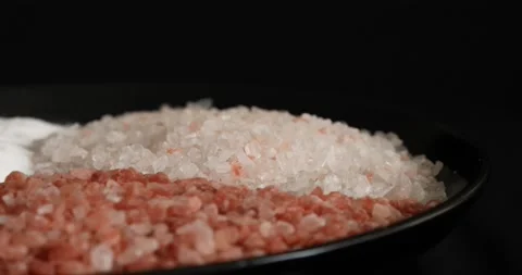 Different salt types rotating on black background 5 스톡 동영상 140928585