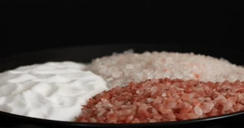 Different salt types rotating on black background 8 Stock Footage 140929990