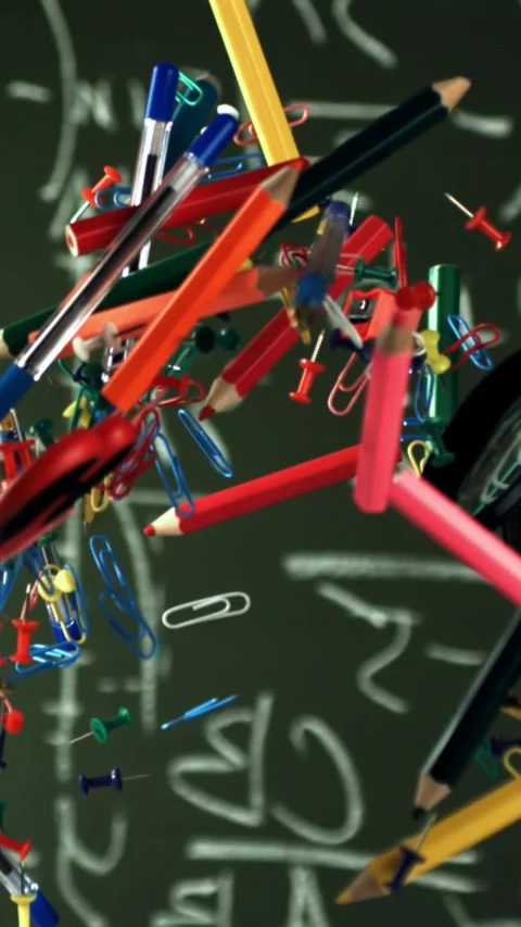 Different school objects fly and fall against the background of the blackboard Stock Footage 335366150