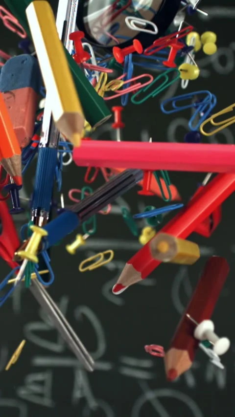 Different school objects fly and fall against the background of the blackboard Stock Footage 335366443