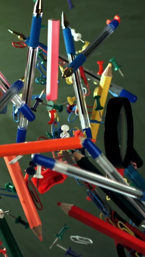 Different school objects fly and fall against the background of the blackboard Stock Footage 335368916