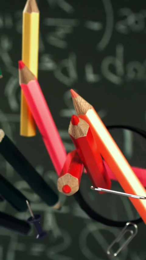 Different school objects fly and fall against the background of the blackboard Stock Footage 335372946