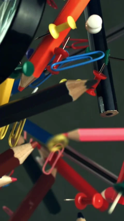 Different school objects fly and fall against the background of the blackboard Stock Footage 335373152