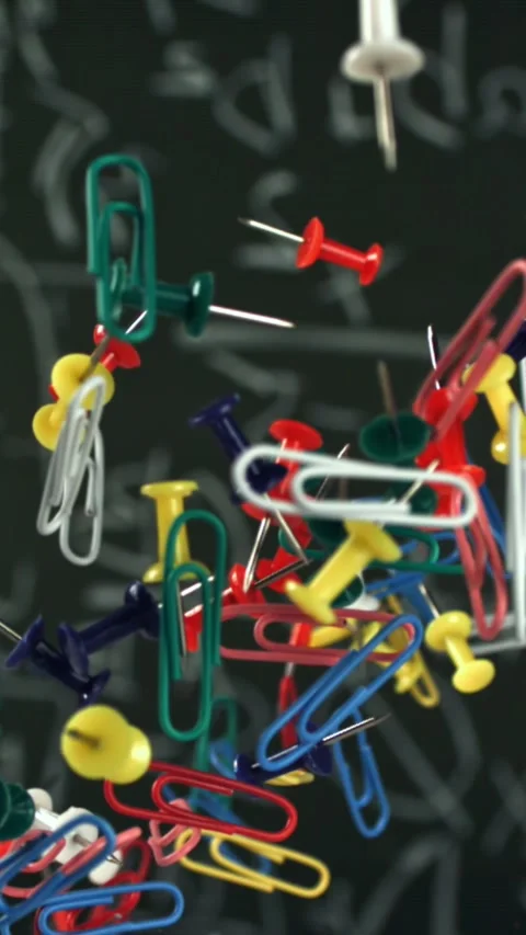 Different school objects fly and fall against the background of the blackboard Stock Footage 335376893