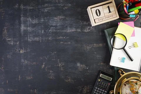 Different school supplies on dark background. Concept Back to school Stock Photos