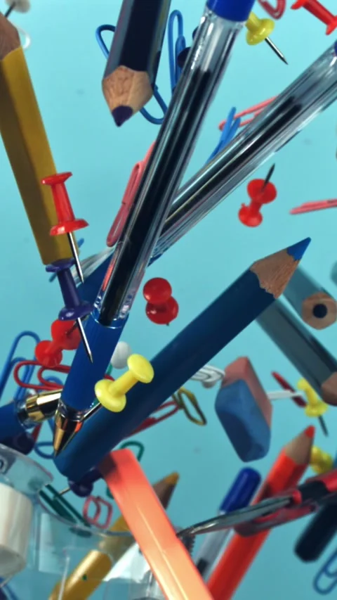 Different school tools fly up and down. Back to school. Filmed on a high-speed Stock Footage 335377979