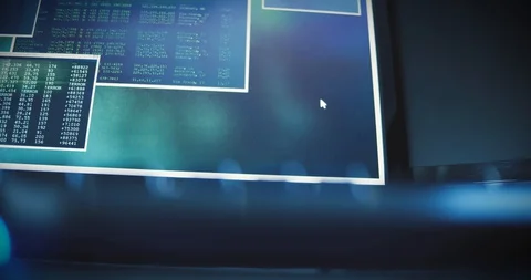 Different screen in a control center show computer code, binary data, data Video stock 127760139