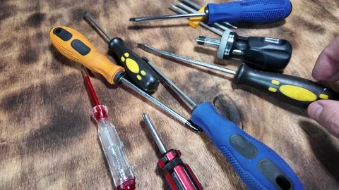 Different screwdrivers on the table. Flat and Phillips screwdrivers. Closeu.. Stock Footage 292384234
