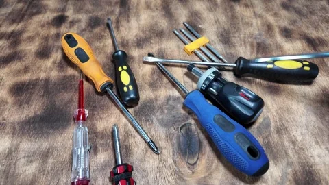 Different screwdrivers on the table. Flat and Phillips screwdrivers. Closeu.. Stock Footage 292384313