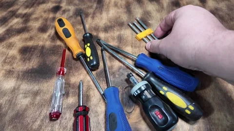 Different screwdrivers on the table. Flat and Phillips screwdrivers. Closeu.. Stock Footage 292384562