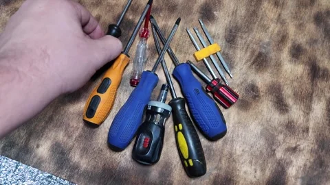 Different screwdrivers on the table. Flat and Phillips screwdrivers. Closeu.. Stock Footage 292384755