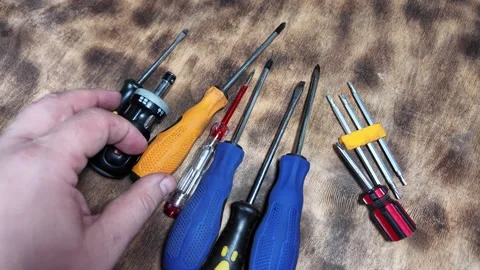 Different screwdrivers on the table. Flat and Phillips screwdrivers. Closeu.. Stock Footage 292385274