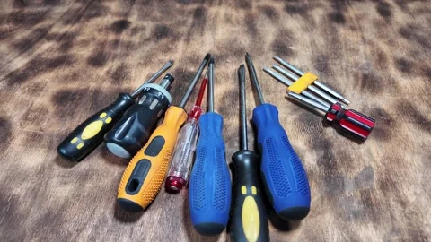 Different screwdrivers on the table. Flat and Phillips screwdrivers. Closeu.. Stock Footage 292385286