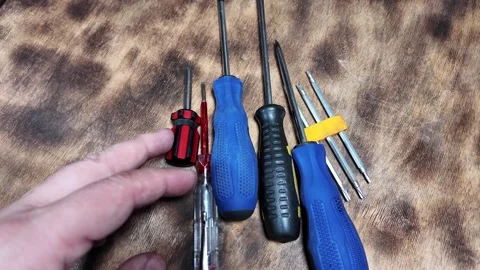 Different screwdrivers on the table. Flat and Phillips screwdrivers. Closeu.. Stock Footage 292385752