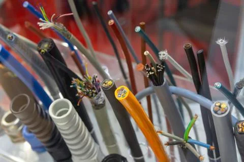 Different separation power cables on the showcase close up. Industry Stock Photos
