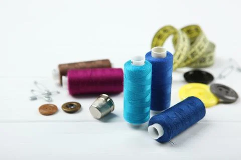 Different sewing accessories on the table. Photos