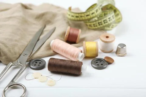 Different sewing accessories on the table. Stock-Fotos