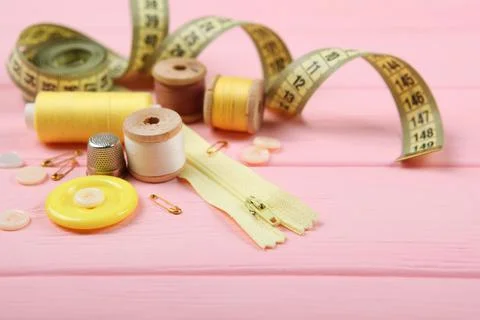 Different sewing accessories on the table. Photos