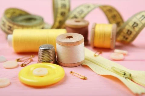 Different sewing accessories on the table. Stock Photos