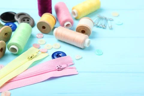 Different sewing accessories on the table. Photos