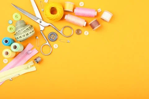 Different sewing accessories on the table. Stock Photos