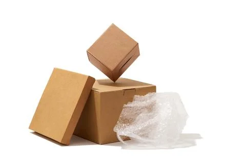 Different shaped cardboard boxes and bubble wrap isolated on white background Stock Photos