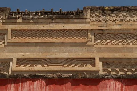 Different shapes, carvings, patterns and red colored wall on the southern fac Stock Photos