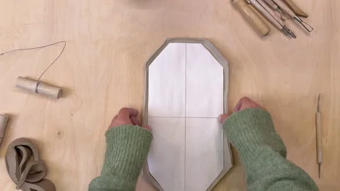 Different shapes of handmade clay plates top view Video stock 306090535