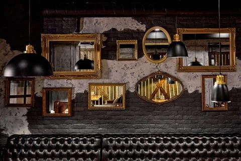 Different shapes of mirrors on the wall Stock Photos