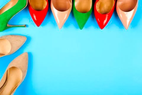 Different shoes on light background. Copy space for text. Stock Photos