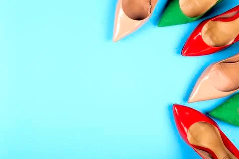 Different shoes on light background. Copy space for text. Stock Photos