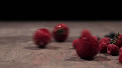 Different shots with the same point of view of mixed fruit thrown on a dark ston Video stock 162344485