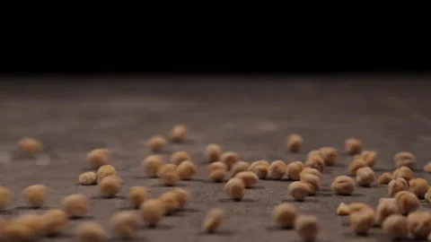 Different shots with the same point of view of dried chickpeas thrown Stock Footage 162344572