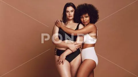 Different size females in lingerie proud of their body Stock Photos