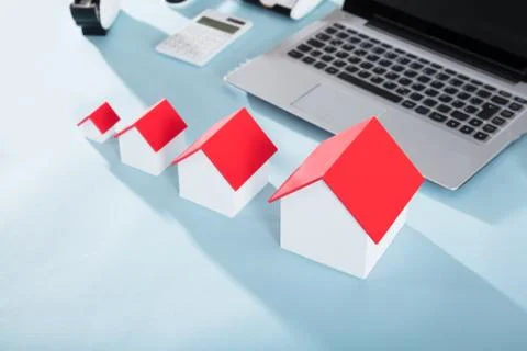 Different Size House Models On Desk Stock Photos