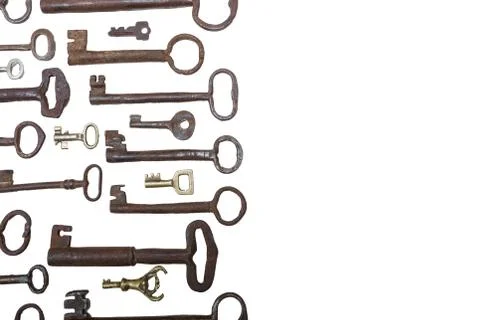 Different size old rusty keys  isolated on white background with copy space Stock Photos