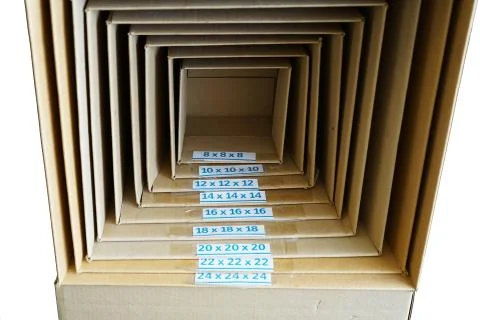 Different size of package cardboard boxes stacking together Stock Photos