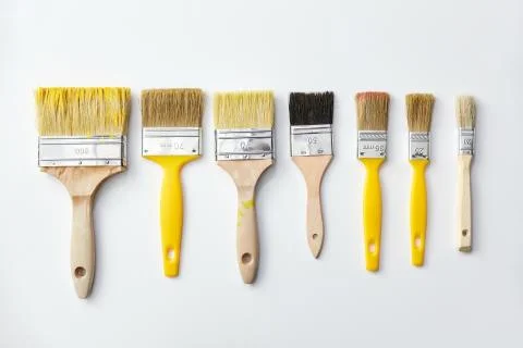 Different size paint brushes on white background Stock Photos