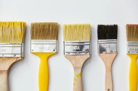 Different size paint brushes on white background Stock Photos