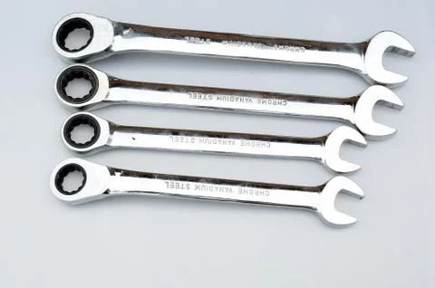 Different size ratchet spanners macro photo isolated on white background Stock Photos