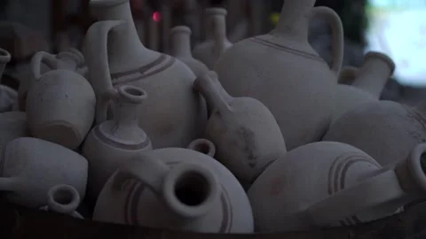 Different sized handmade clay jags of grey colour with lines Stock Footage 149577602