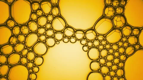 Different sized oily bubbles explode spontaneously at a time Stock Footage 157655640