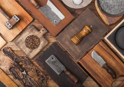 Different sizes and shapes kitchen chopping boards on wooden background Stock Photos