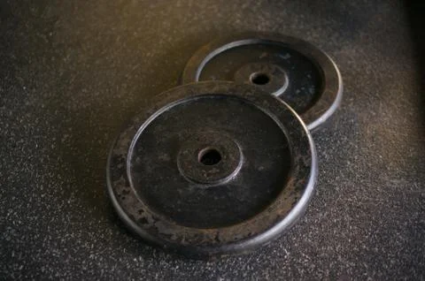 Different sizes and weights for barbell weight lift training in modern gym Stock Photos