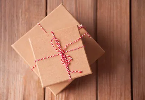 Different sizes Christmas gift boxes on the wooden background Stock Photos