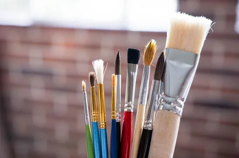 Different sizes of paint brushes Stock Photos