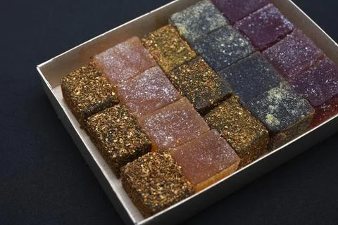 Different slices of marmalade in a box. Assorted marmalade close-up. A swee.. Stock Photos
