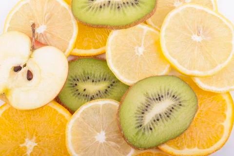 Different slices of sliced fruit. Stock Photos