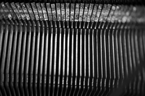 Different small metal elements of an old typewriter Stock Photos